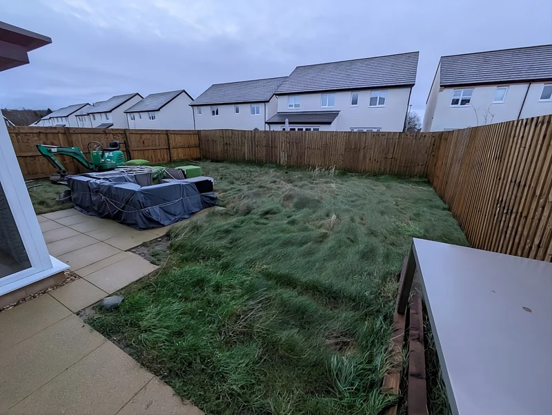 Garden before paving, with lawn and equipment