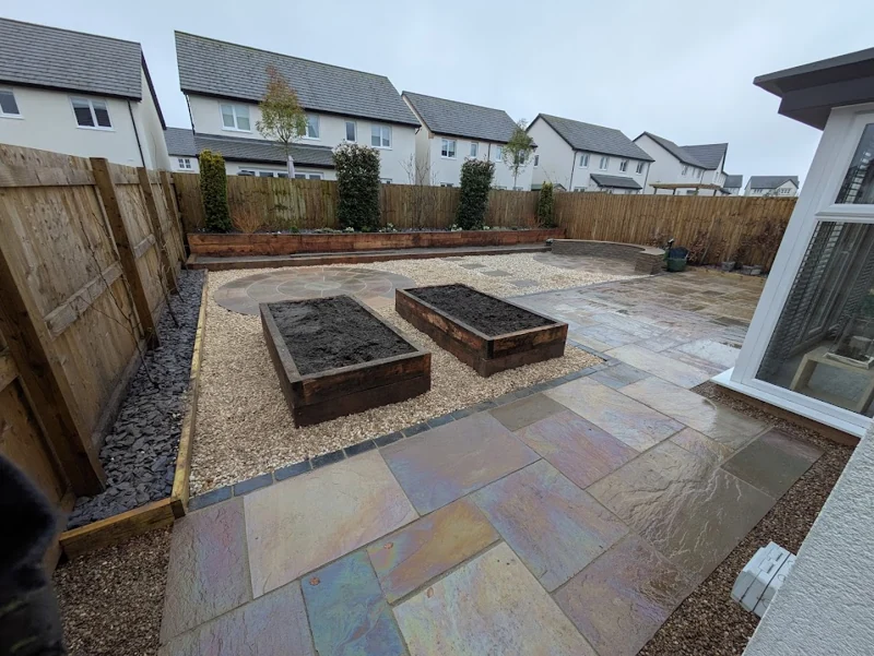 Garden after paving, with raised beds and gravel
