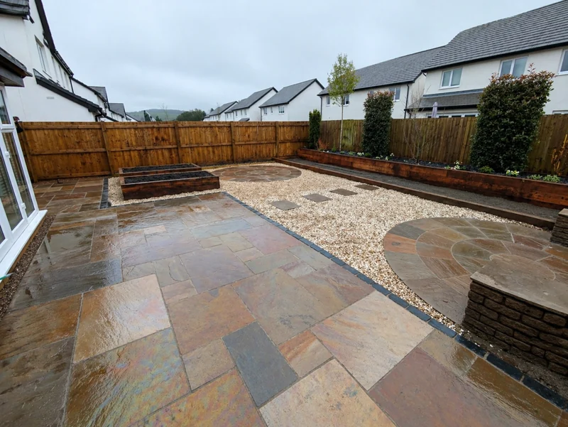 Garden after paving, with raised beds and gravel